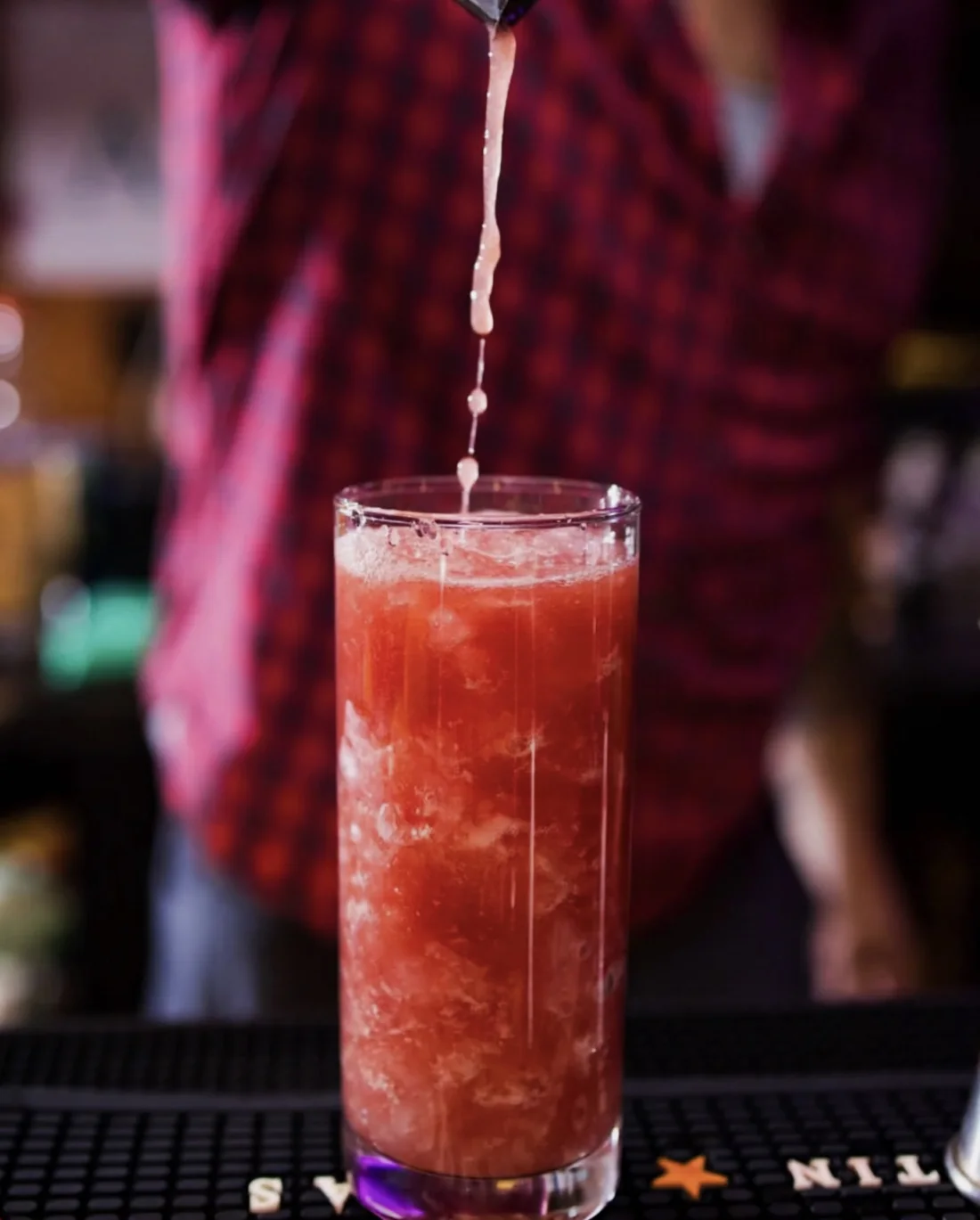 A cocktail being poured at the Easy Tiger bar.